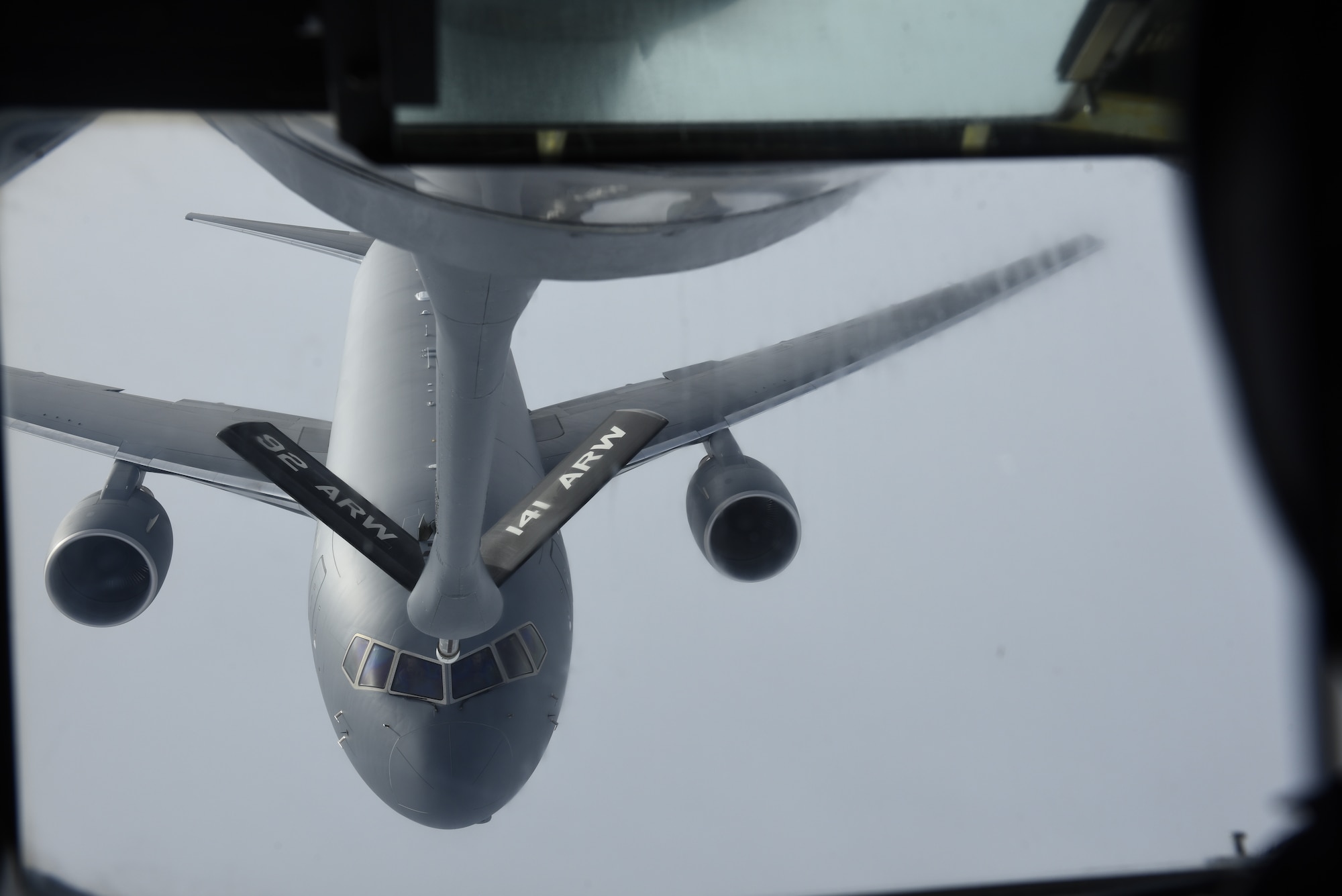 The crew of a new KC-46 Pegasus aerial-refueling aircraft practice making refueling hose connections with a KC-135 Stratotanker over Washington, January 22, 2019. Team Fairchild's 384th Air Refueling Squadron was the first to train with the newly-produced aircraft to train pilots and boom operators to work with the new refueling aircraft. (U.S. Air Force photo/Airman 1st Class Lawrence Sena)