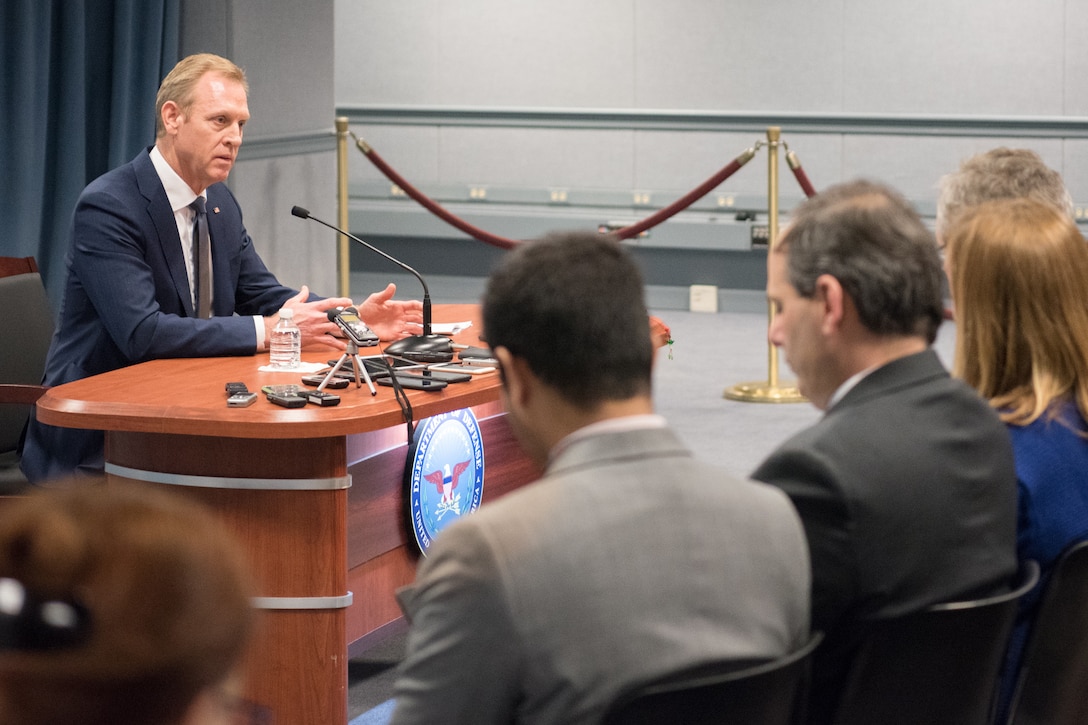 Acting defense secretary talks with reporters.