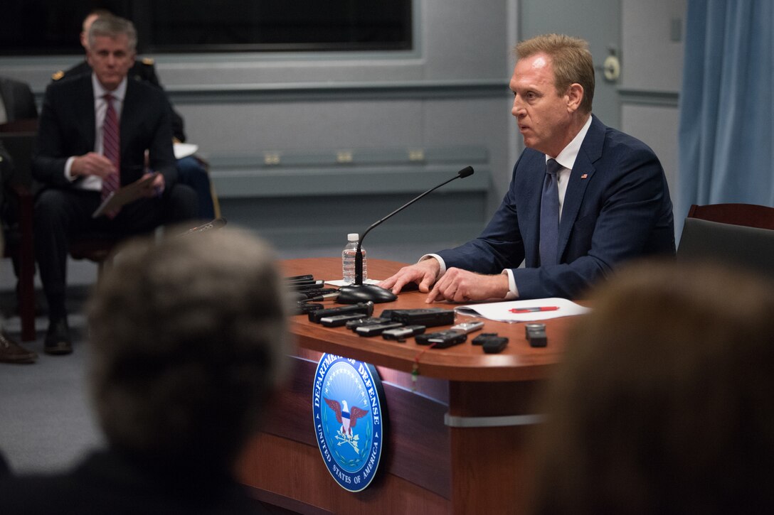 Acting defense secretary speaks at a news conference.