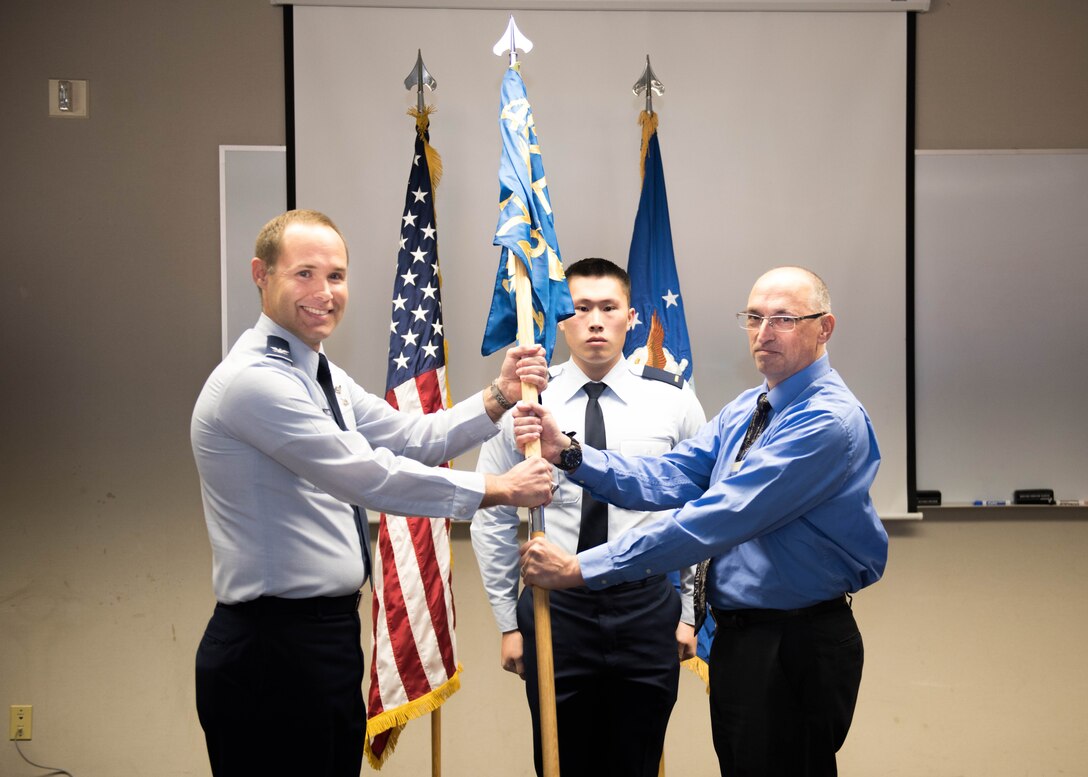 Above: Col. Sean Bradley, 412th Electronic Warfare Group commander, poses for a photo with new 772nd Test Squadron civilian leader Kirk Harwood during an assumption of leadership ceremony held Jan. 25. After leaving the Air Force as an officer, Harwood became a flight test engineer at Edwards AFB in March 1993 and has worked a variety of test programs before coming to the 772nd TS. 
The 772nd TS operates and maintains test facilities and capabilities for a wide spectrum of electronic warfare and information operations systems. The squadron oversees the Benefield Anechoic Facility, a uniquely large anechoic chamber that provides a comprehensive, robust and scalable radio frequency test and evaluation infrastructure and capability to ensure weapons system survivability and mission effectiveness for the DOD, industry (military and commercial) and allies.
