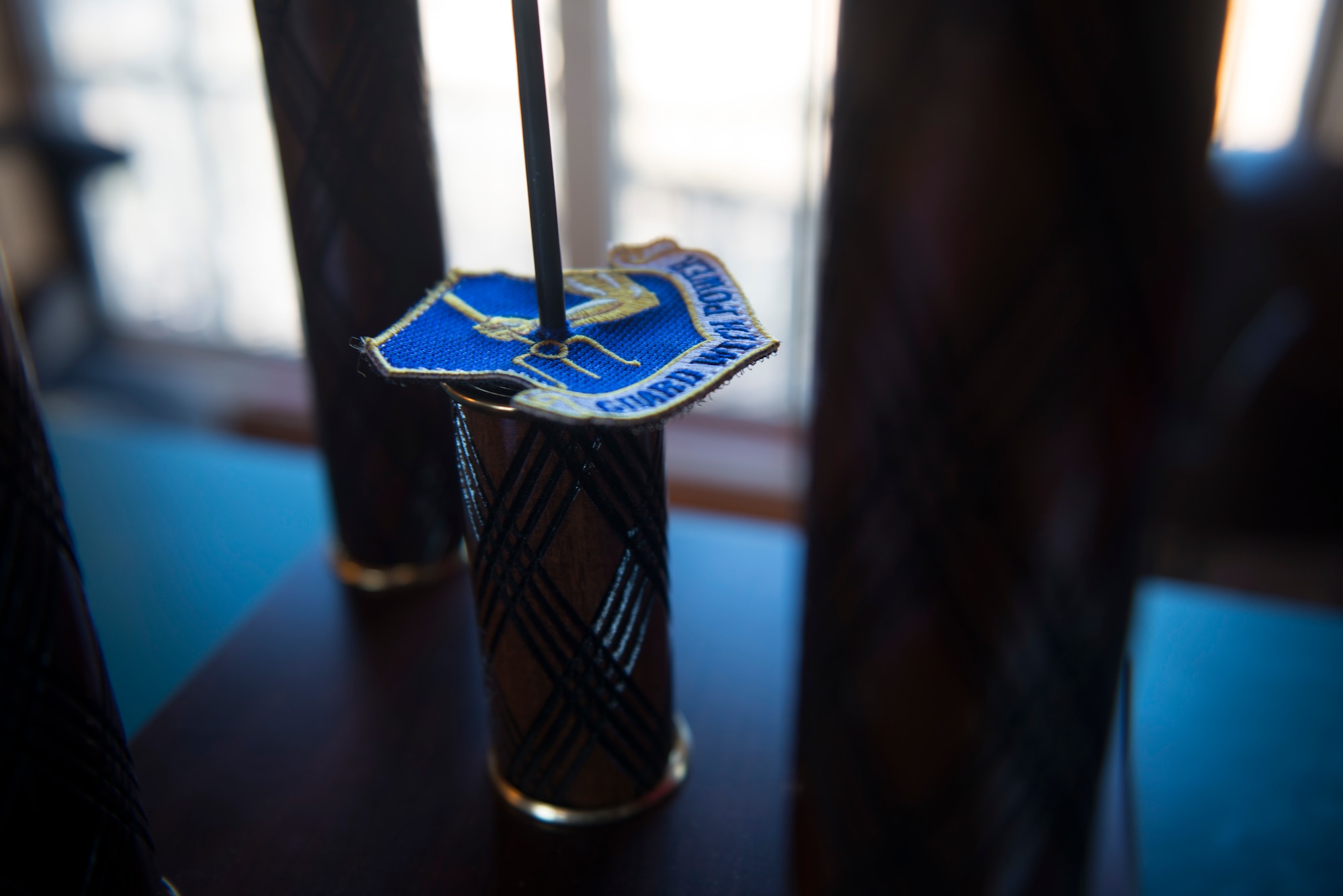 The 25th Attack Group unit patch is pierced by the trophy spear following a friendly shootout at the Skeet and Trap Range, Shaw Air Force Base S.C., Jan 25.
