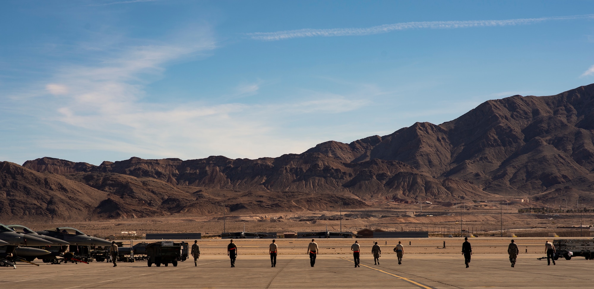U.S. Airmen assigned to the 20th Aircraft Maintenance Squadron, 79th Aircraft Maintenance Unit, perform a foreign object and debris (FOD) walk during Exercise Red Flag 19-1 at Nellis Air Force Base, Nev., Jan. 28, 2019.