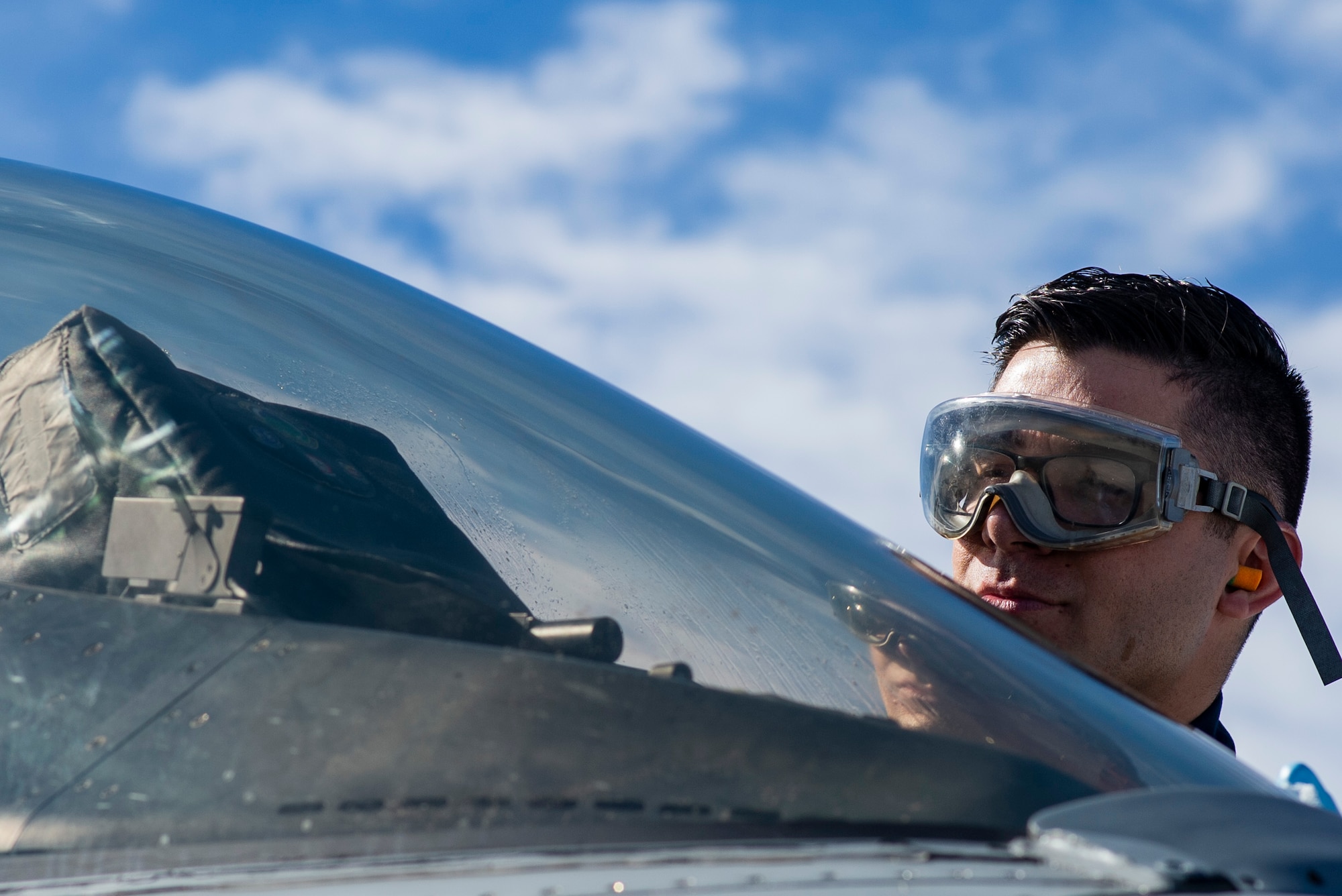 U.S. Air Force Senior Airman Eric Conner, 20th Aircraft Maintenance Squadron, 79th Aircraft Maintenance Unit crew chief, cleans the canopy of an F-16CM Fighting Falcon during Exercise Red Flag 19-1 at Nellis Air Force Base, Nev., Jan. 28, 2019.