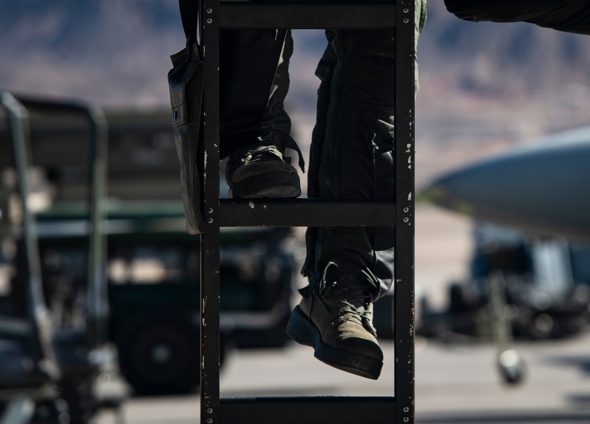 A U.S. Air Force pilot assigned to the 79th Fighter Squadron (FS) prepares to climb into an F-16CM Fighting Falcon during Exercise Red Flag 19-1 at Nellis Air Force Base, Nev., Jan. 28, 2019.