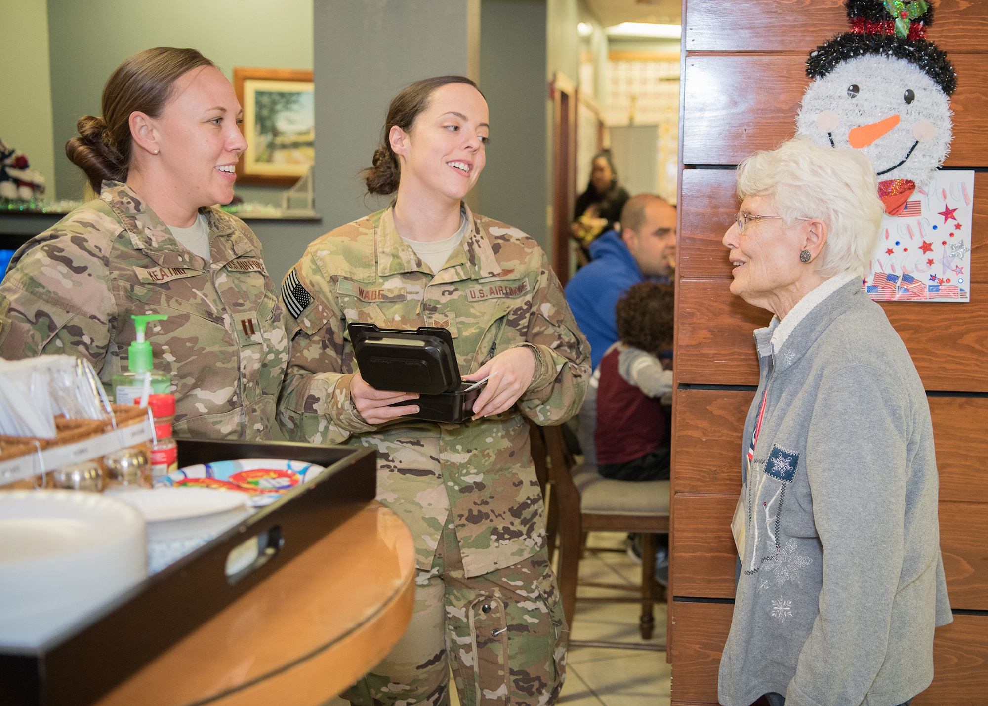 Nancy Sahrbeck (right), USO Delaware volunteer, chats with traveling Airmen at the USO Delaware Terminal Community Center Jan. 18, 2019, at Dover Air Force Base, Delaware. The mission of the USO is “connecting service members to family, home and country.” (U.S. Air Force photo by Mauricio Campino)