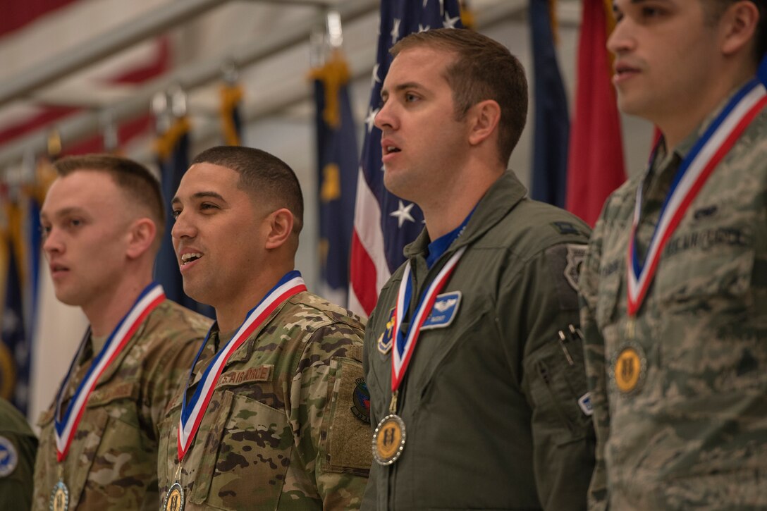 Annual award winners from the 33rd Fighter Wing sing the Air Force song during the 2018 Annual Awards Ceremony Jan. 25, 2019, at Eglin Air Force Base, Fla. The annual awards ceremony provides an opportunity to recognize the hard work that Nomads have displayed all year and distinguish Airmen who epitomize the core values. (U.S. Air Force photo by Staff Sgt. Peter Thompson)