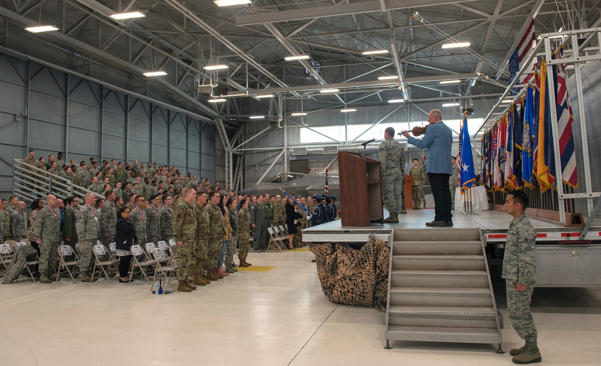 John Winkler, 33rd Fighter Wing integration officer, plays the national anthem on his violin during the 2018 Annual Awards Ceremony Jan. 25, 2019, at Eglin Air Force Base, Fla. The annual awards ceremony provides an opportunity to recognize the hard work that Nomads have displayed all year and distinguish Airmen who epitomize the core values. (U.S. Air Force photo by Staff Sgt. Peter Thompson)