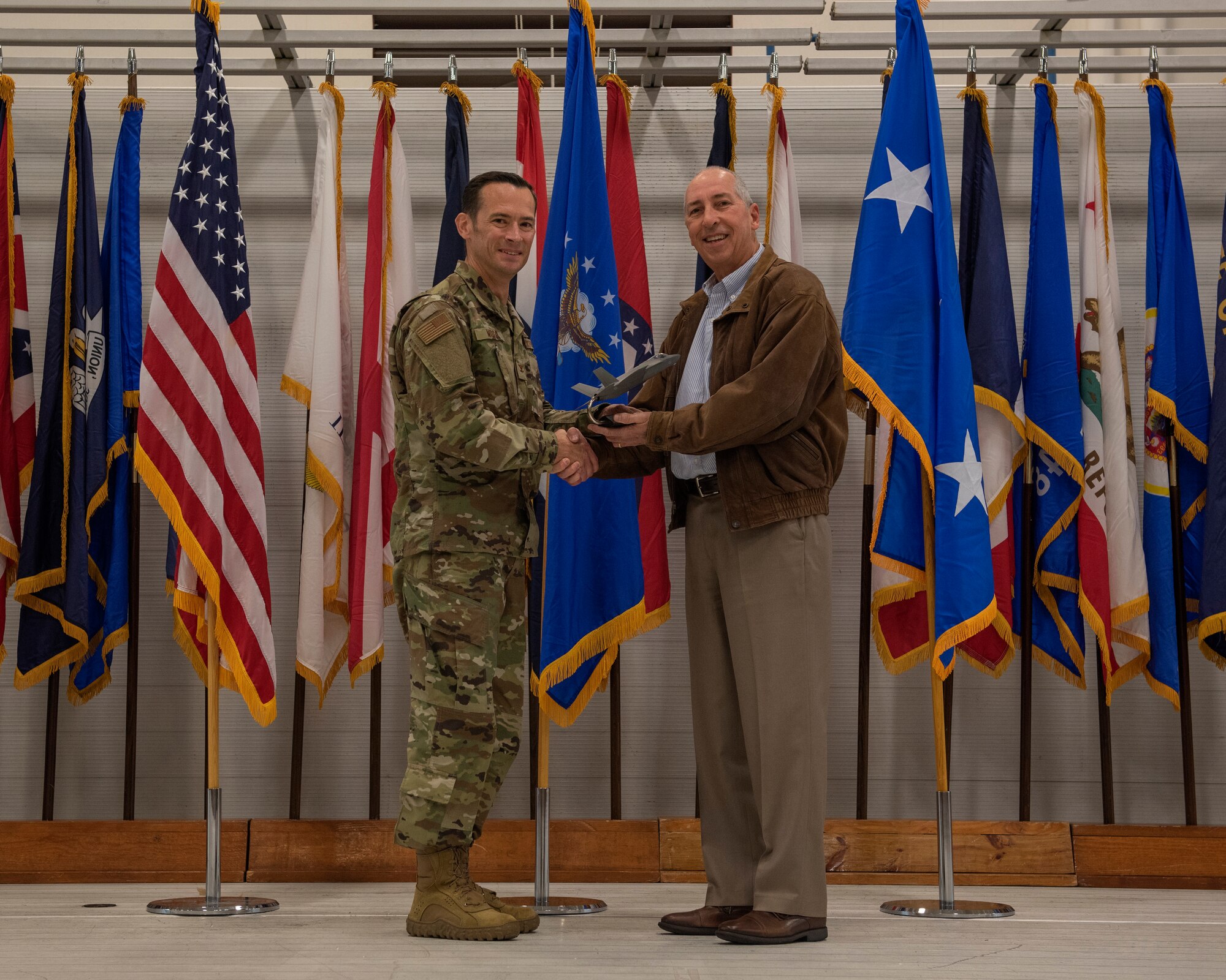 Mr. Jerry Williams, an outgoing member of the Air Education and Training Command commander's civic leader group, is presented with a token of appreciation by Col. Paul Moga, 33rd Fighter Wing commander, during the 2018 Annual Awards Ceremony Jan. 25, 2019, at Eglin Air Force Base, Fla. Williams selflessly devoted his time and resources to champion the needs of the 33rd FW at the major command level and provided support to the local AETC community. (U.S. Air Force photo by Staff Sgt. Peter Thompson)