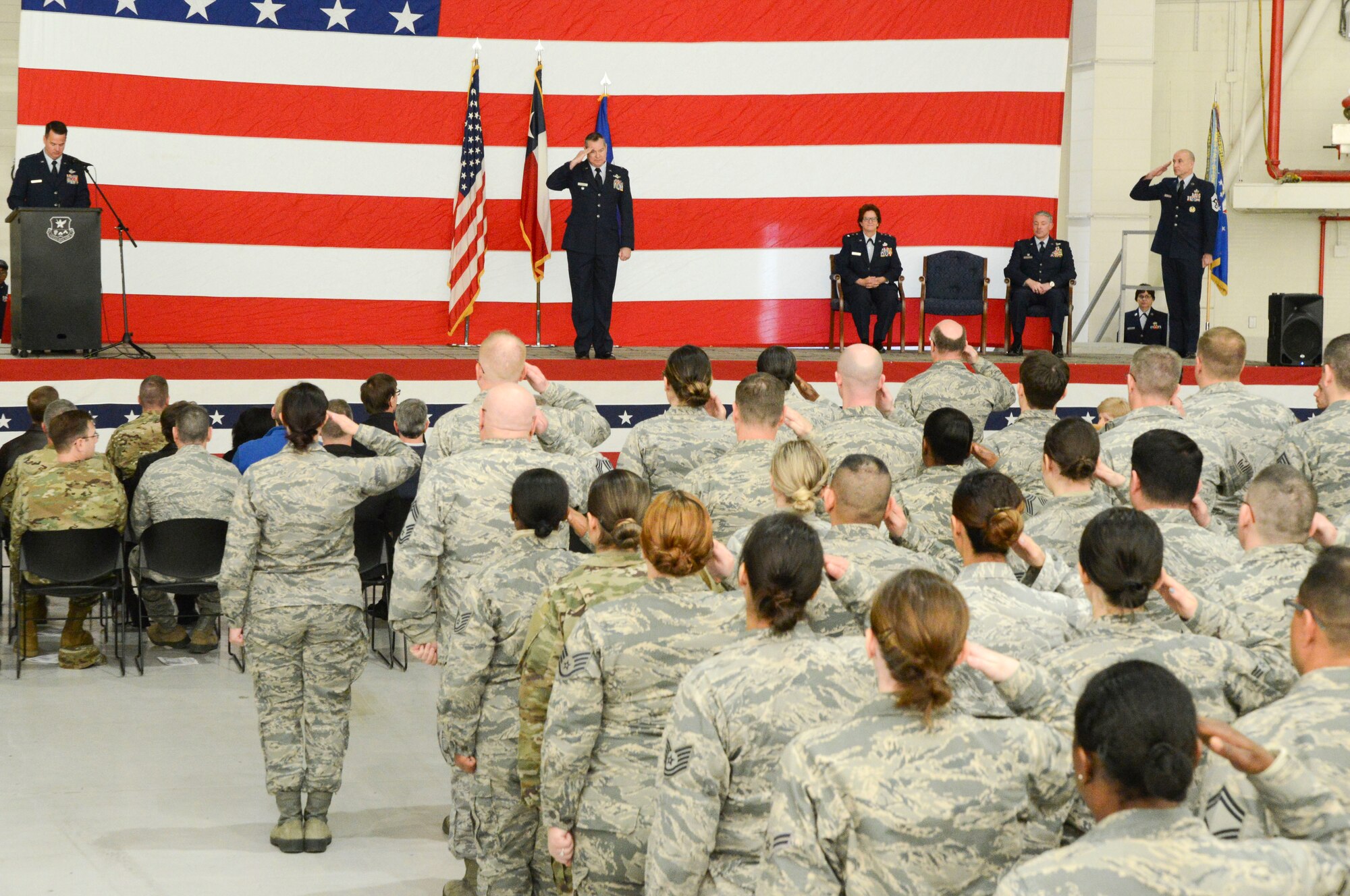 Col. Christopher McGraw, 136th Airlift Wing incoming commander, salutes wing Airmen shortly after assuming command of the wing here January 26, 2019. McGraw returns to the 136th AW where he previously served from March 2001 to March 2017.