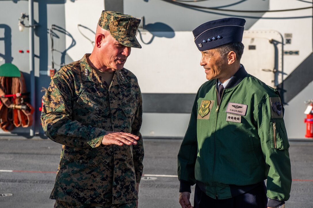 Lt. Gen. Joseph L. Osterman, the commanding general of I Marine Expeditionary Force, speaks with Gen. Yoshinari Marumo, chief of staff, Japan Air Self-Defense Force, during a tour of the amphibious assault ship USS America (LHA 6) while docked at Naval Base San Diego, Jan. 25. During the tour, the guests viewed the flight deck, navigation facilities and hangar bay to gain a better understanding of short take-off and vertical landing operations. (U.S. Marine Corps photo by Sgt. Devan K. Gowans)