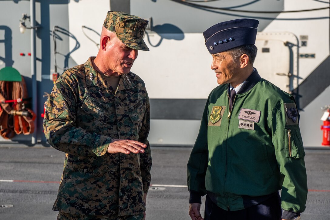 Lt. Gen. Joseph L. Osterman, the commanding general of I Marine Expeditionary Force, speaks with Gen. Yoshinari Marumo, chief of staff, Japan Air Self-Defense Force, during a tour of the amphibious assault ship USS America (LHA 6) while docked at Naval Base San Diego, Jan. 25.