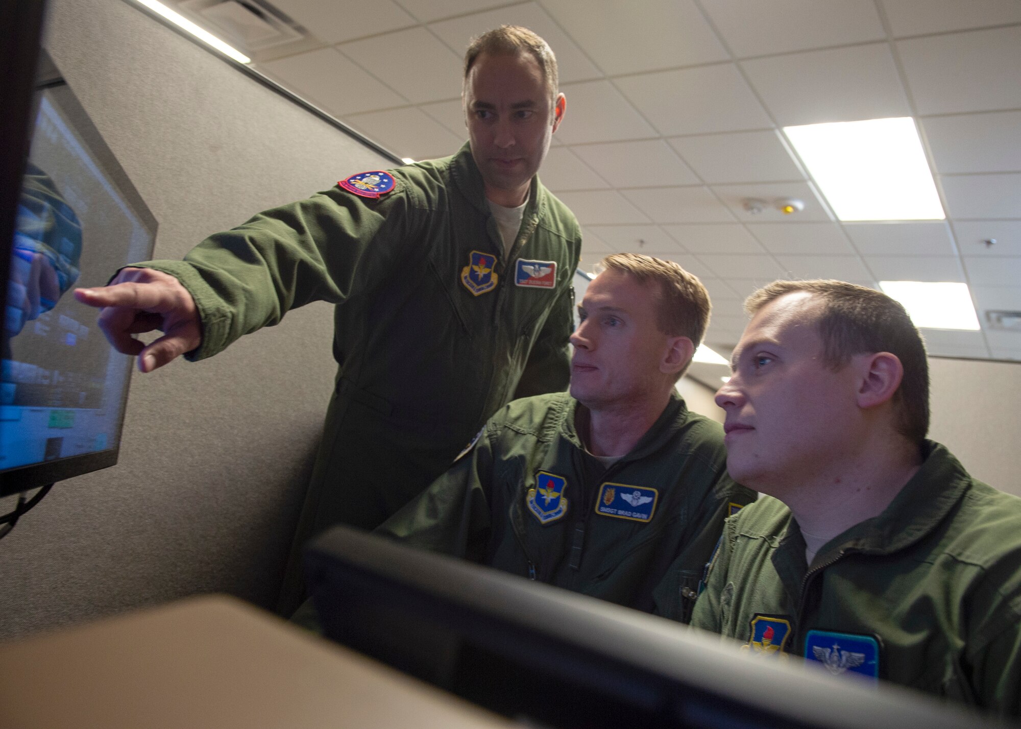 Instructors assigned to the 56th Air Refueling Squadron test the new KC-46 Pegasus PTT simulator, Dec. 20, 2019, at Altus Air Force Base, Okla. The KC-46 is the new in-air refueling aircraft purchased by the United States Air Force. (U.S. Air Force Photo by Senior Airman Jackson N. Haddon)