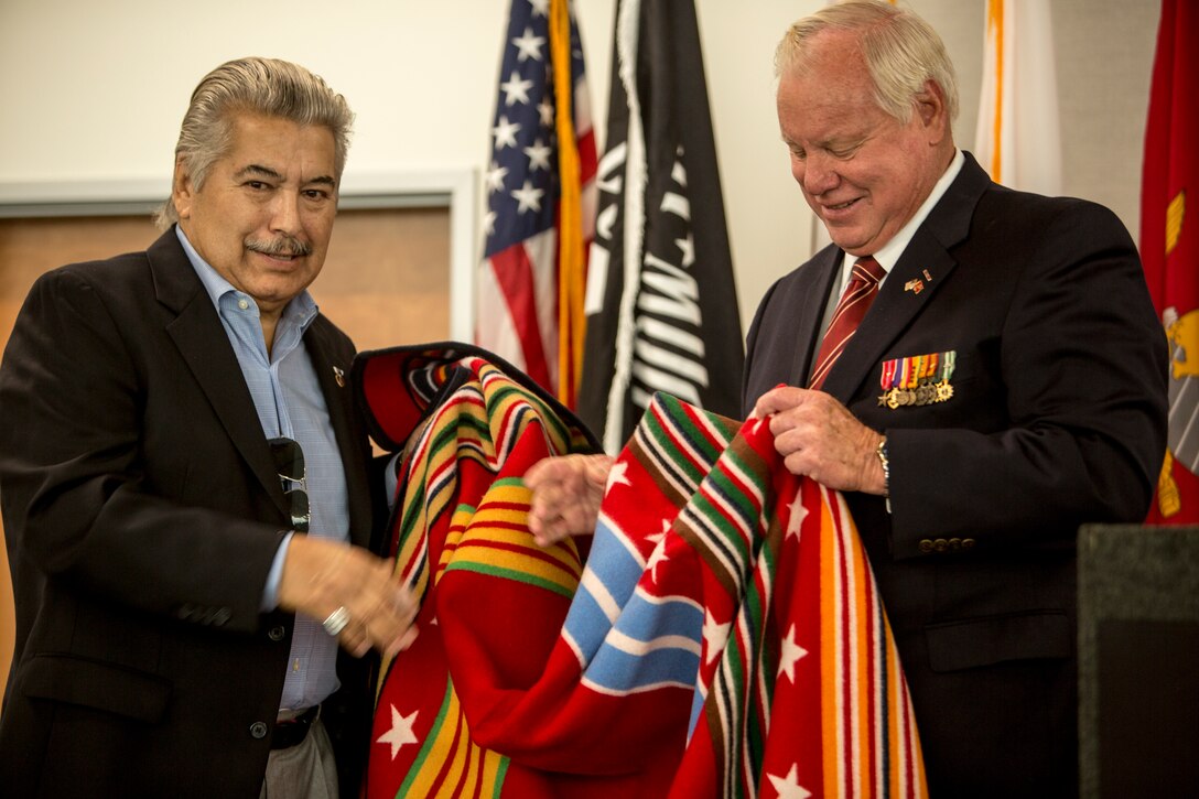 Retired Marine Corps Capt. Bill Horn receives a decorated robe as a token of appreciation for his military service at the North Inland Live Well Center in Escondido, Calif., Nov. 8, 2018.