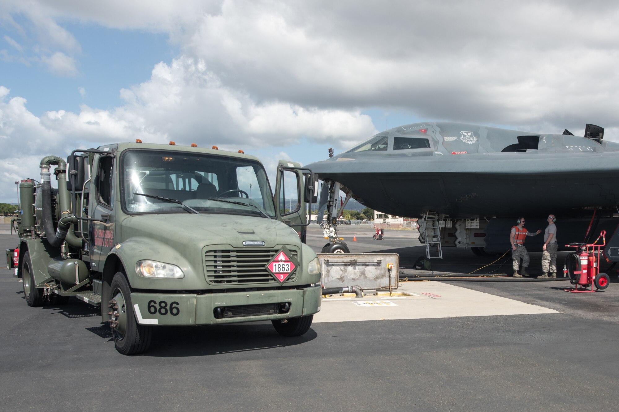 509th Logistics Readiness Squadron fuel distribution operators from Whiteman Air Force Base, Missouri, conduct a hot-pit refueling on a B-2 Spirit Bomber at Joint Base Pearl Harbor-Hickam, Hawaii Jan. 22, 2019.