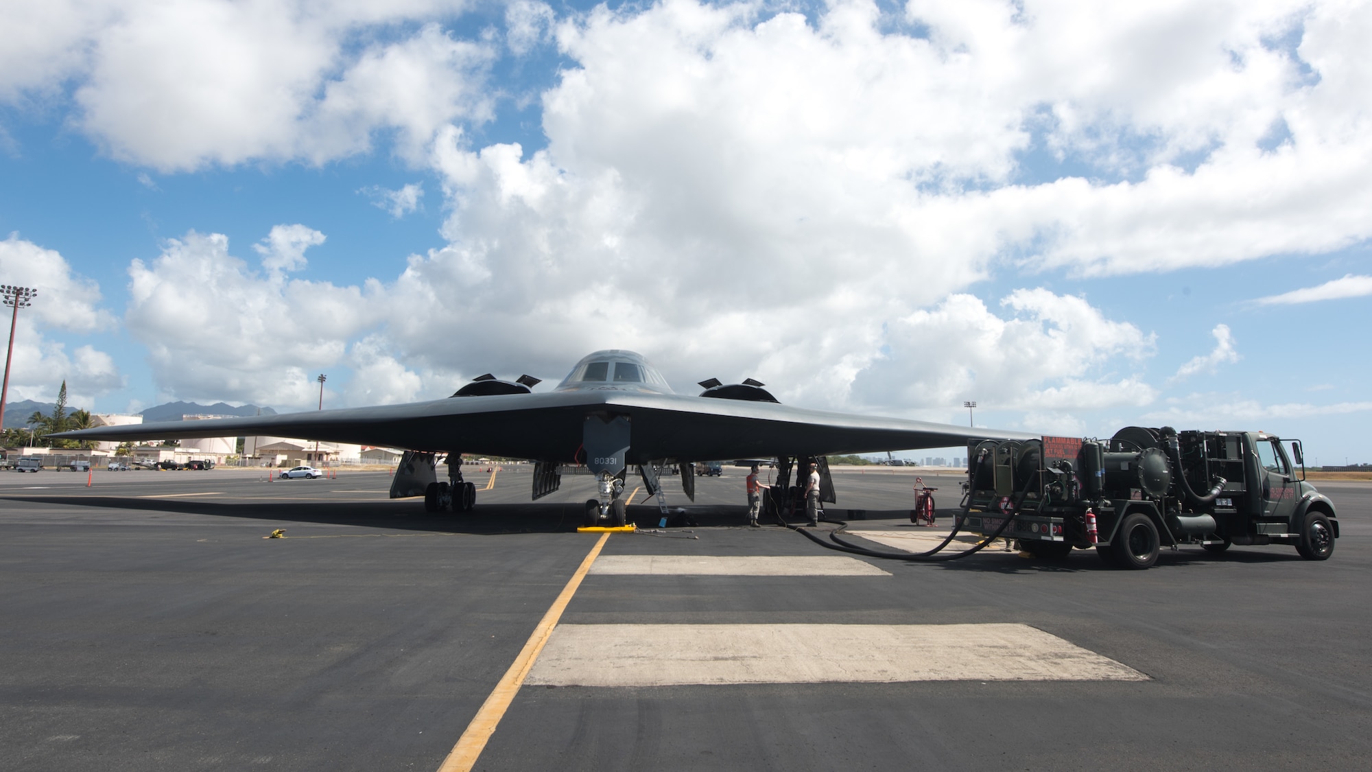 509th Logistics Readiness Squadron fuel distribution operators from Whiteman Air Force Base, Missouri ,conduct a hot-pit refueling on a B-2 Spirit Bomber at Joint Base Pearl Harbor-Hickam, Hawaii Jan. 22, 2019