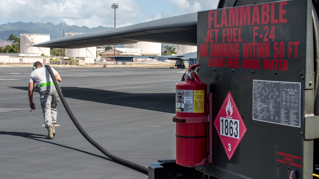 Tech. Sgt. Chad Jamerson, 509th Logistics Readiness Squadron fuel distribution operator deployed from Whiteman Air Force Base, Missouri, conducts a hot-pit refueling on a B-2 Spirit Bomber at Joint Base Pearl Harbor-Hickam, Hawaii Jan. 22, 2019.