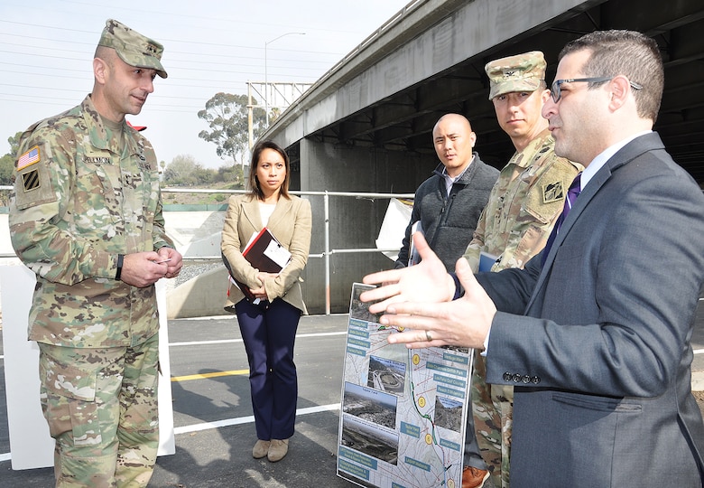 From left to right, Maj. Gen. Scott Spellmon, U.S. Army Corps of Engineers deputy commanding general for Civil and Emergency Operations; Lillian Doherty, LA District chief of the Operations Branch; Eric Nguyen, project manager, Operations Branch, and Col. Aaron Barta, LA District commander, listen to a Los Angeles city official talk about the LA River during a project tour Jan. 11 in Los Angeles.