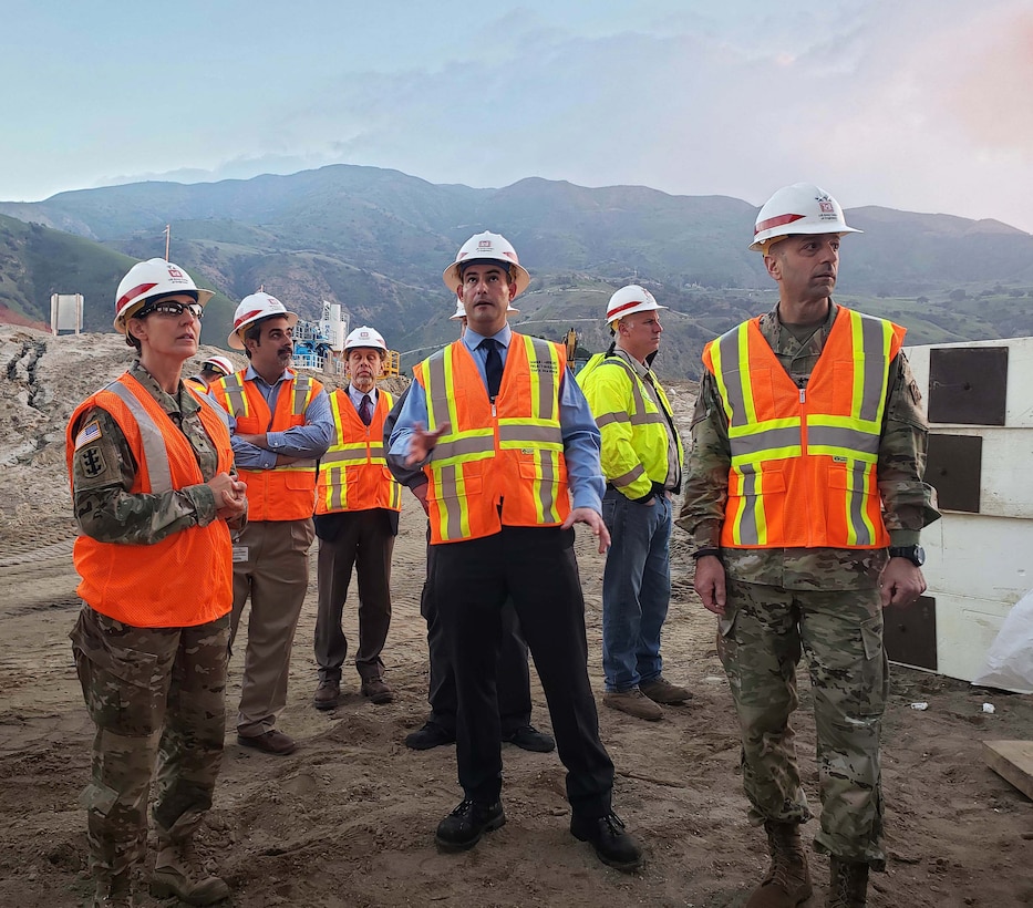 Damien Lariviere, project manager, U.S. Army Corps of Engineers Los Angeles District, center, talks to Maj. Gen. Scott Spellmon, U.S. Army Corps of Engineers deputy commanding general for Civil and Emergency Operations, right, and Brig. Gen. Kim Colloton, South Pacific Division commander, left, about the Santa Ana River Mainstem project during a Jan. 9 tour of the Prado Dam basin.