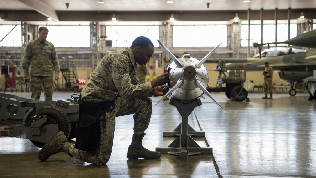 U.S. Air Force Senior Airman Mario Robinson, a 14th Aircraft Maintenance Unit weapons load crew member, inspects an inert munition during the fourth quarter weapons load competition at Misawa Air Base, Japan, Jan. 18, 2019. Team Misawa Airmen with the 35th Aircraft Maintenance Squadron take part in this friendly competition ensuring readiness and proper munition handling while racing against the clock. (U.S. Air Force photo by Airman 1st Class Collette Brooks)