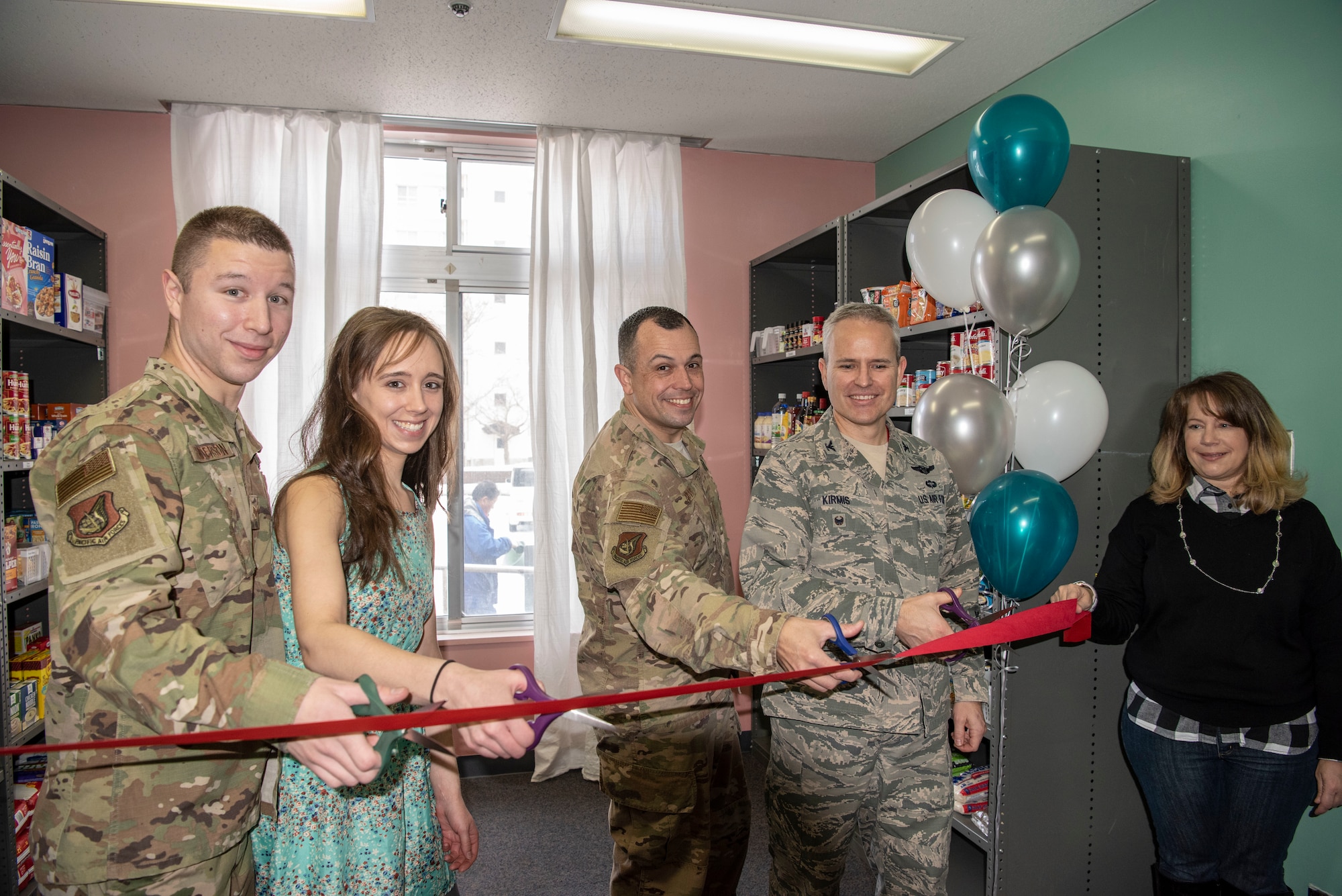 The 35th Fighter Wing Misawa Air Base wing leadership and thrift shop employee and volunteer cut a ribbon during the Misawa Thrift Shop food pantry opening at MAB, Japan, Jan. 29, 2019. Active duty members and their families can now pick up non-perishable, shelf-stable and non-expired packing food items at no cost. (U.S. Air Force photo by Airman 1st Class Xiomara Martinez)