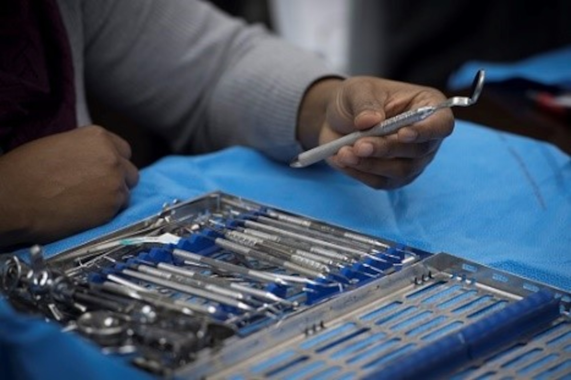 Marjorie Chery, a Red Cross Dental Assisting volunteer, looks through the various instruments commonly used by dentists during a Red Cross Dental Assistant course, Jan. 9, 2019, at Yokota Air Base, Japan.