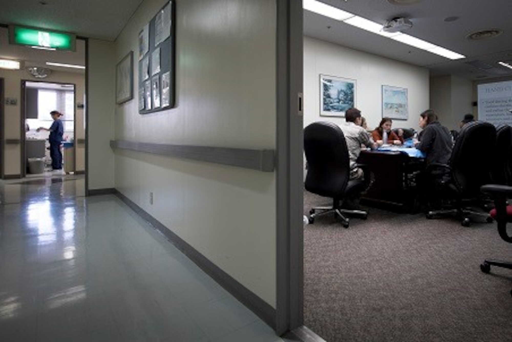Tech Sgt. Thomas McCarthy, 374th Dental Squadron dental assisting craftsman and volunteer Red Cross Dental Assistant program coordinator, teaches a Red Cross Dental Assistant class while a current dental volunteer works in a patient room down the hall, Jan. 9, 2019, at Yokota Air Base, Japan.