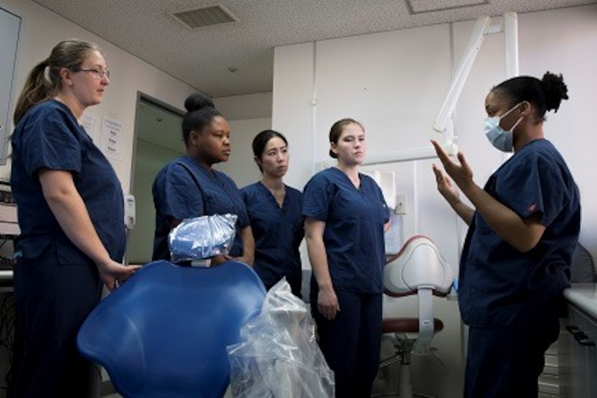 Senior Airman Johnetta Jones, 374th Dental Squadron dental assistant, teaches volunteers how to prep, work, and clean a dental treatment room during the American Red Cross Dental Assistant training course, Jan. 11, 2019, at Yokota Air Base, Japan.