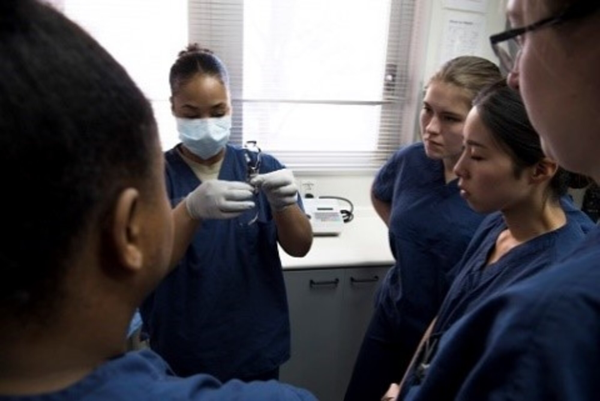 Senior Airman Johnetta Jones, 374th Dental Squadron dental assistant, shows how to set up tools during a Red Cross Dental Assistant course, Jan. 11, 2019, at Yokota Air Base, Japan.