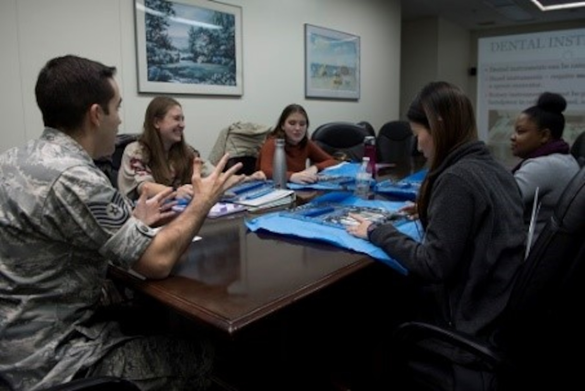 Tech Sgt. Thomas McCarthy, 374th Dental Squadron dental assistant craftsman and Red Cross volunteer Dental Assistant program coordinator, teaches a group of volunteers about different tools commonly used by dentists during a Red Cross Dental Assistant course, Jan. 9, 2019, at Yokota Air Base, Japan.