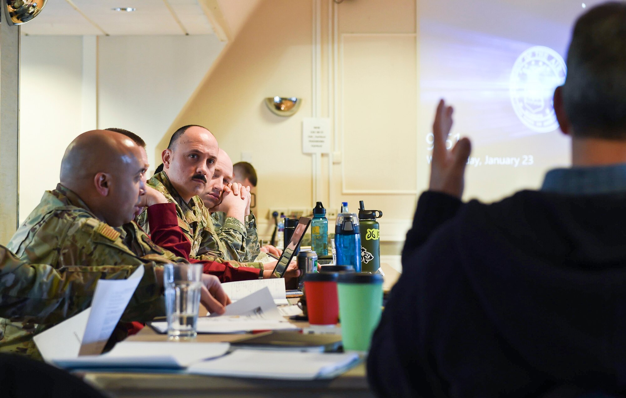 U.S. Air Force Major Jose Quintanilla (left), Wing Logistics Officer for 501st Combat Support Wing, discusses the synchronization of operations during a planning conference at RAF Fairford, England on January 23, 2019. The venue brought together 30 key personnel from across the different 501st CSW bases in an effort to plan for potential future operations as well as maintain readiness within the European theater. (U.S. Air Force photo by Tech. Sgt. Brian Kimball)