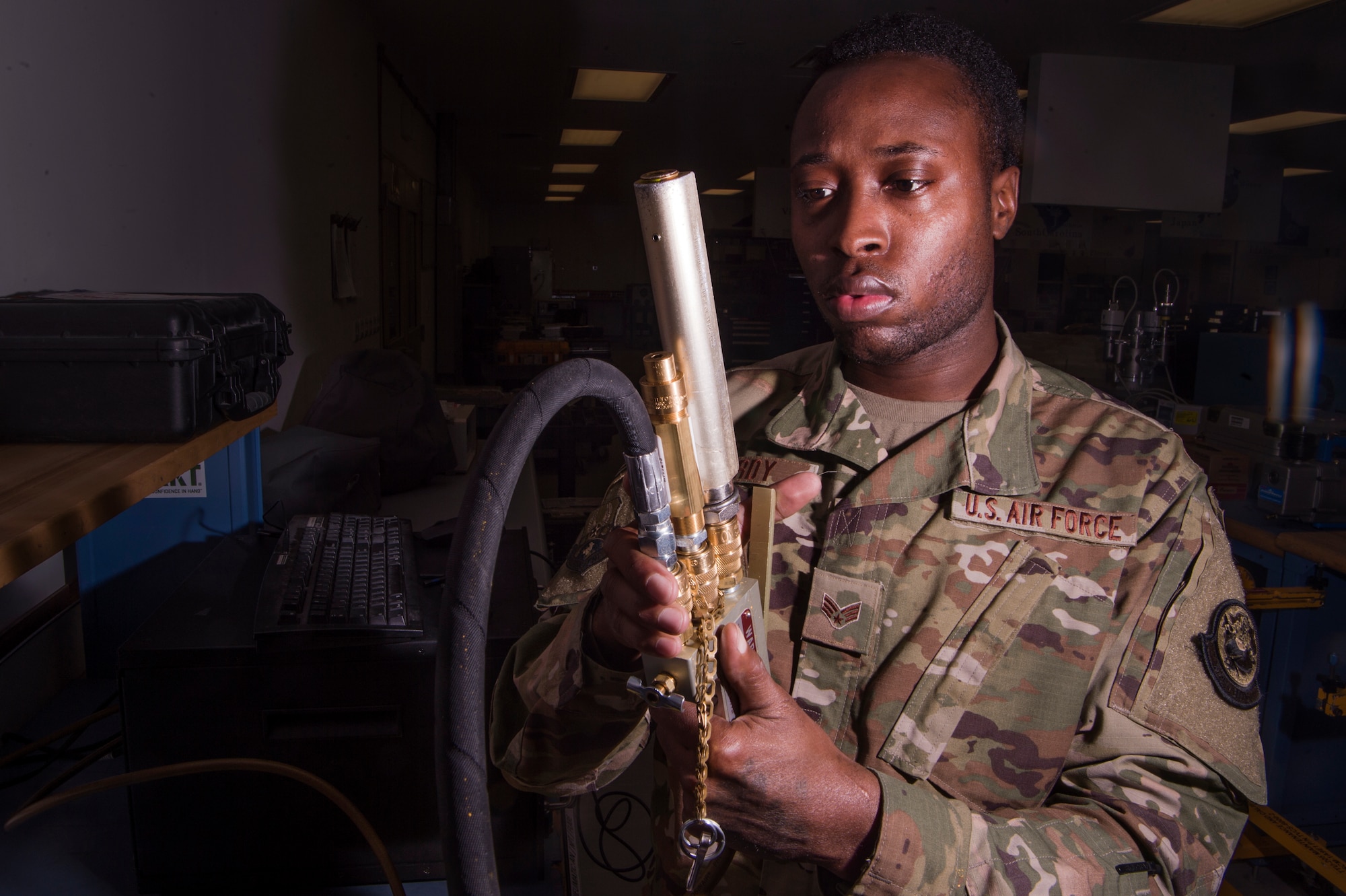 Senior Airman LaTerry Hardy, 379th Expeditionary Maintenance Squadron (EMXS) precision measurement equipment laboratory (PMEL) physical dimensions technician, uses a relief valve to set maximum tire pressures for tire inflator kits Jan. 25, 2019, at Al Udeid Air Base, Qatar. Members of Al Udeid’s PMEL team support other deployed locations across U.S. Air Forces Central Command’s area of responsibility and can forward deploy when equipment isn’t able to be shipped here for repair. The team supports approximately 14,000 pieces of test, measurement and diagnostic equipment used by various other career fields. (U.S. Air Force Tech. Sgt. Christopher Hubenthal)