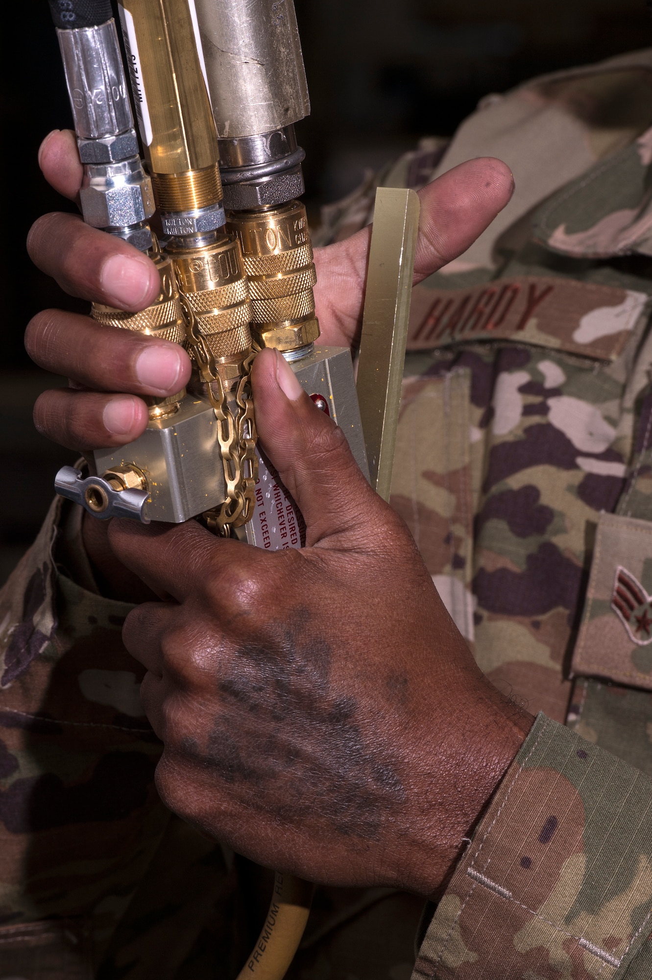 Senior Airman LaTerry Hardy, 379th Expeditionary Maintenance Squadron (EMXS) precision measurement equipment laboratory (PMEL) physical dimensions technician, uses a relief valve to set maximum tire pressures for tire inflator kits Jan. 25, 2019, at Al Udeid Air Base, Qatar. Members of Al Udeid’s PMEL team support other deployed locations across U.S. Air Forces Central Command’s area of responsibility and can forward deploy when equipment isn’t able to be shipped here for repair. The team supports approximately 14,000 pieces of test, measurement and diagnostic equipment used by various other career fields. (U.S. Air Force Tech. Sgt. Christopher Hubenthal)