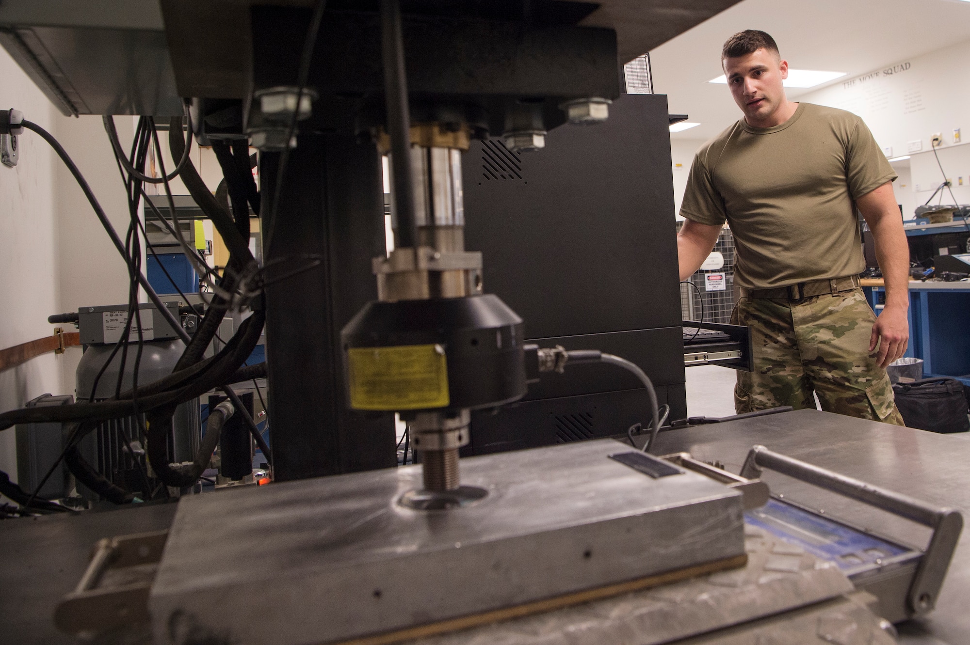 Staff Sgt. Ryan Perez, 379th Expeditionary Maintenance Squadron (EMXS) precision measurement equipment laboratory (PMEL) test, measurement and diagnostic equipment (TMDE) craftsman, calibrates a wheel load scale with a force presser Jan. 25, 2019, at Al Udeid Air Base, Qatar. The team supports approximately 14,000 pieces of TMDE and can forward deploy to locations throughout U.S. Air Forces Central Command to provide precise calibration for equipment that can’t be transported to Al Udeid. (U.S. Air Force Tech. Sgt. Christopher Hubenthal)