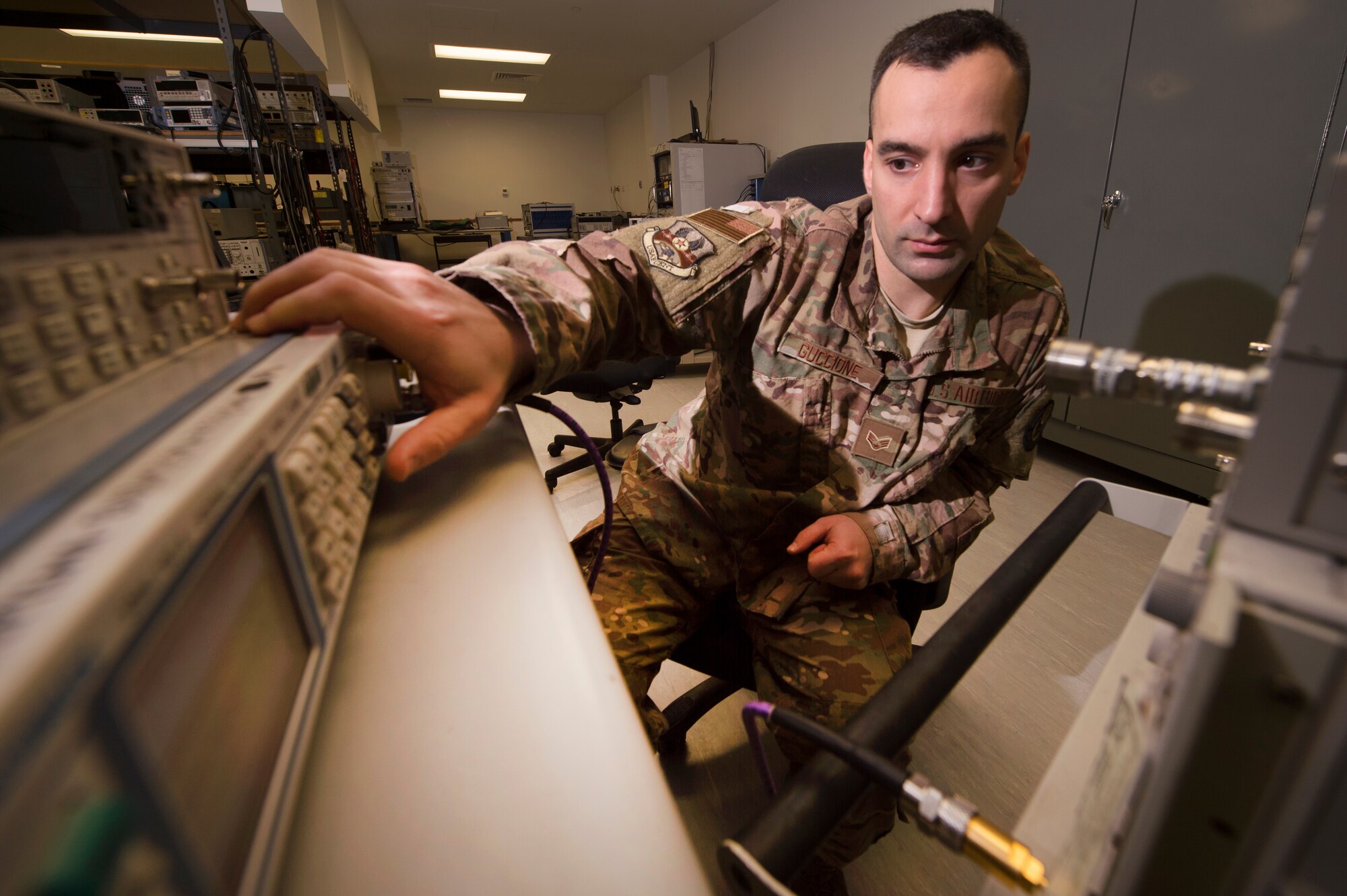 Senior Airman Marco Guccione, 379th Expeditionary Maintenance Squadron (EMXS) precision measurement equipment laboratory (PMEL) test, measurement and diagnostic equipment (TMDE) technician, calibrates a signal generator using a frequency counter and a microwave measuring receiver Jan. 25, 2019, at Al Udeid Air Base, Qatar. The team supports approximately 14,000 pieces of TMDE and can forward deploy to locations throughout U.S. Air Forces Central Command to provide precise calibration for equipment that can’t be transported to Al Udeid. (U.S. Air Force Tech. Sgt. Christopher Hubenthal)