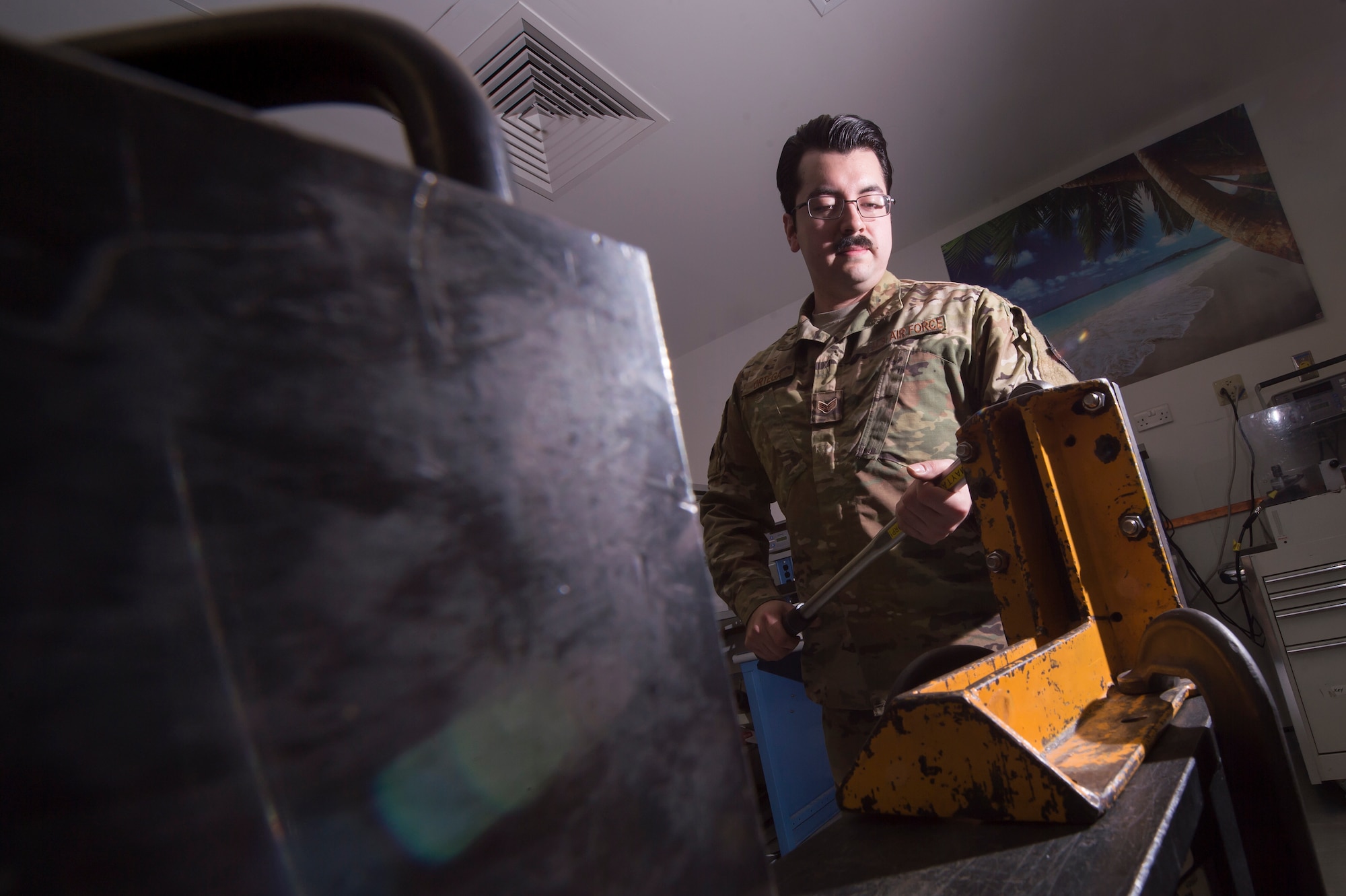Senior Airman Javier Ortega, 379th Expeditionary Maintenance Squadron (EMXS) precision measurement equipment laboratory (PMEL) test, measurement and diagnostic equipment (TMDE) technician, calibrates a torque wrench Jan. 25, 2019, at Al Udeid Air Base, Qatar. The team supports approximately 14,000 pieces of TMDE and can forward deploy to locations throughout U.S. Air Forces Central Command to provide precise calibration for equipment that can’t be transported to Al Udeid. (U.S. Air Force Tech. Sgt. Christopher Hubenthal)