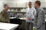 Maj. Gen. John J. DeGoes (left), 59th Medical Wing commander, speaks about the capabilities of the Gateway Bulverde Clinic with Col. Robert Bogart (right), 59th Medical Operations Group commander, and Senior Airman Noah Williams (center), 59th MDW laboratory technician Jan. 25. The Gateway Bulverde Clinic features comprehensive family health care with on-site laboratory and pharmacy services.