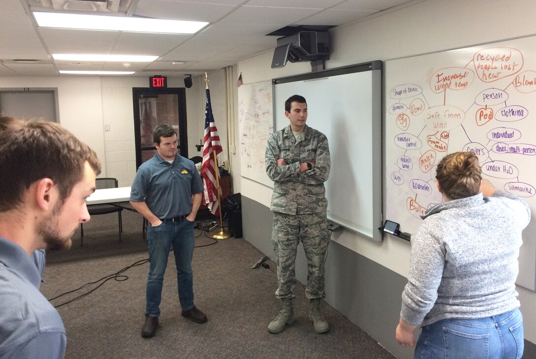 Students discuss life raft ideas