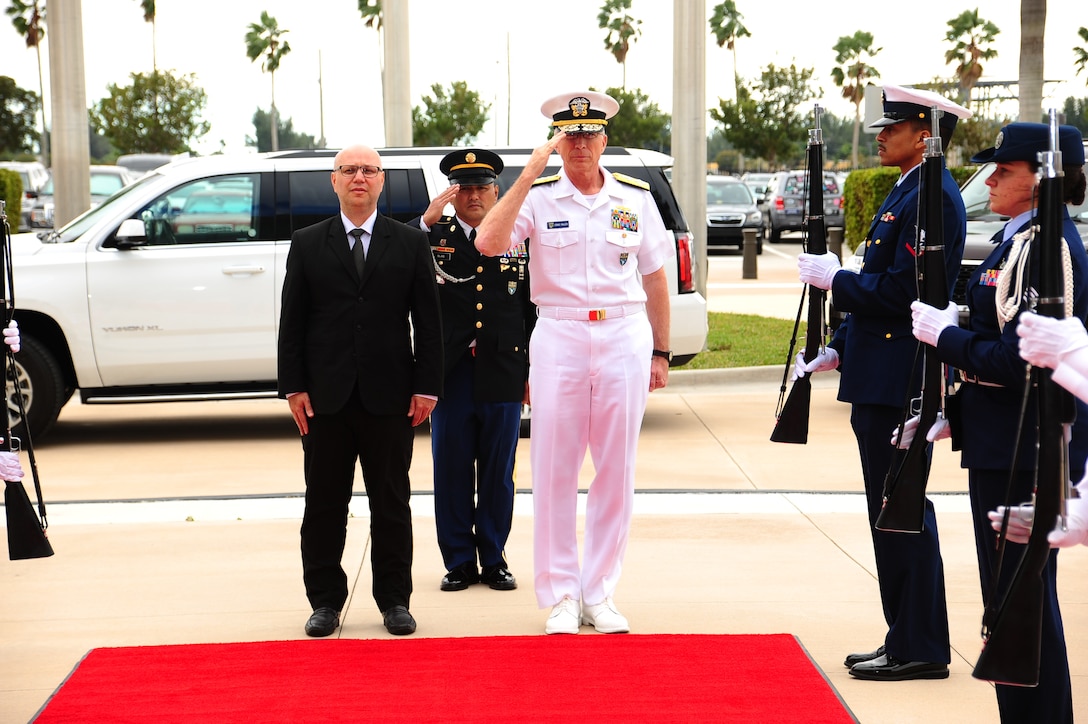 The commander of U.S. Southern Command, Navy Adm. Craig Faller, renders honors during the arrival of Costa Rica's Minister of Public Security, Michael Soto Rojas, to SOUTHCOM headquarters.