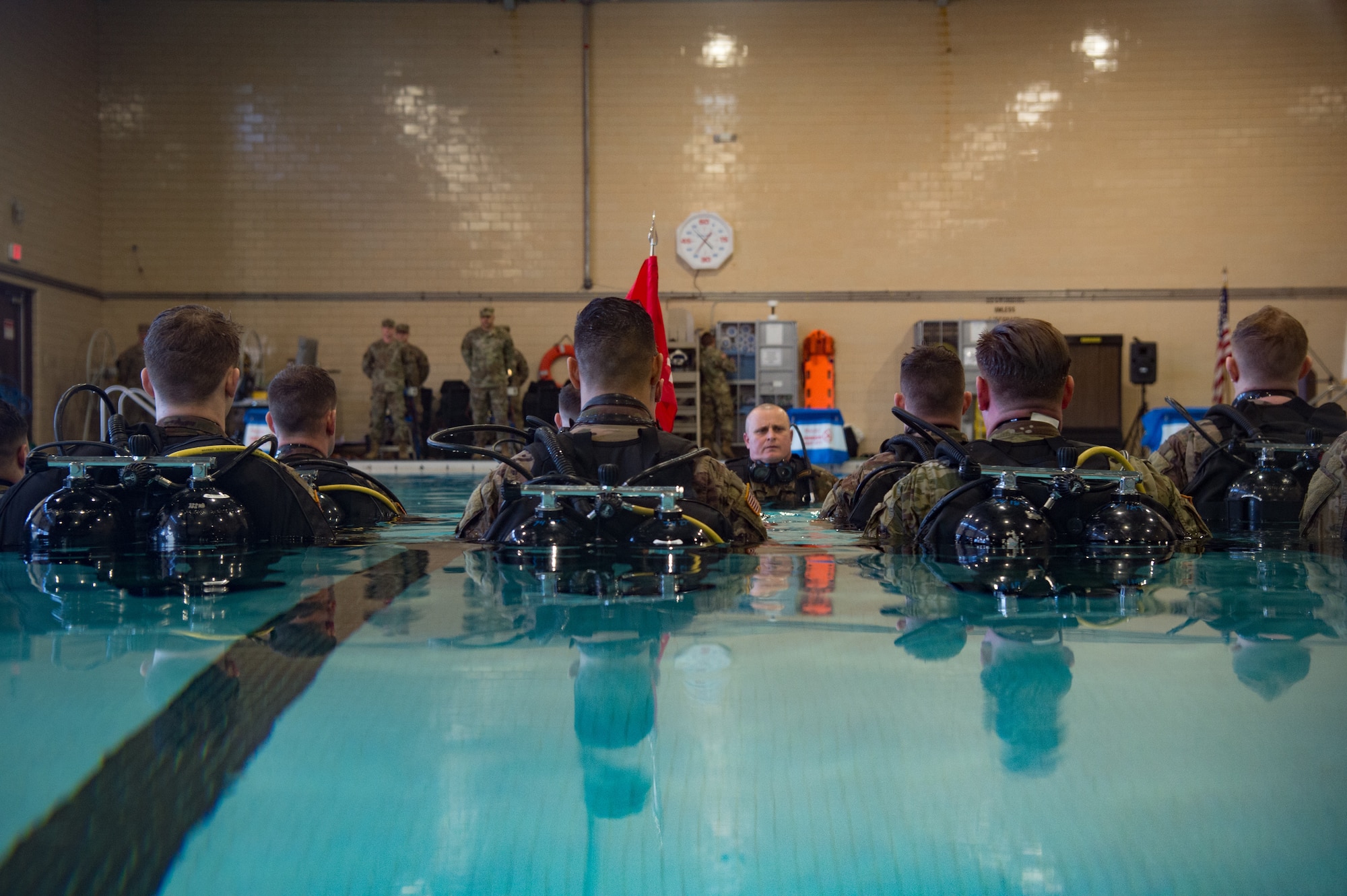 U.S. Army Soldiers from the 74th Engineer Dive Detachment, 92nd Eng. Battalion, stand at attention during a change of command ceremony at the Anderson Field House pool at Joint Base Langley-Eustis, Virginia, Jan. 25, 2019.