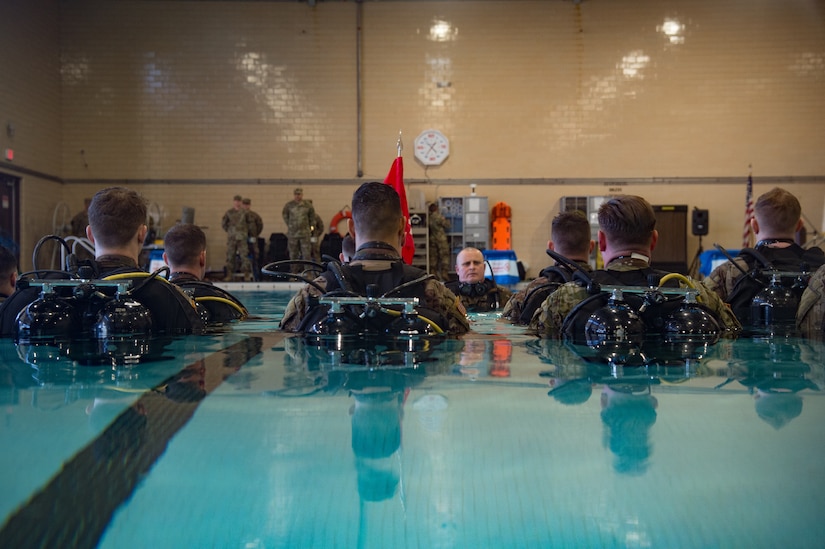 U.S. Army Soldiers from the 74th Engineer Dive Detachment, 92nd Eng. Battalion, stand at attention during a change of command ceremony at the Anderson Field House pool at Joint Base Langley-Eustis, Virginia, Jan. 25, 2019.