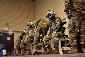 (Right) U.S. Army Capt. Barrett LeHardy, 74th Engineer Dive Detachment, 92nd Eng. Battalion outgoing commander, (middle) Lt. Col. Perry Stiemke, 92nd Eng. Btn. commander, and (left) Capt. Maxwell McDonnell, 74th Eng. Dive Det., 92nd Eng. Btn., don their diving gear during a change of command ceremony at the Anderson Field House pool at Joint Base Langley-Eustis, Virginia, Jan. 25, 2019.