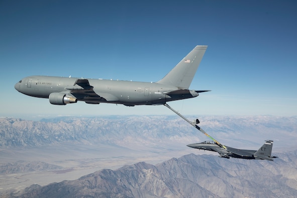 A new KC-46A Pegasus connects with an F-15 Strike Eagle for an aerial refueling test over California in 2018. (Courtesy photo by John D. Parker/Boeing)