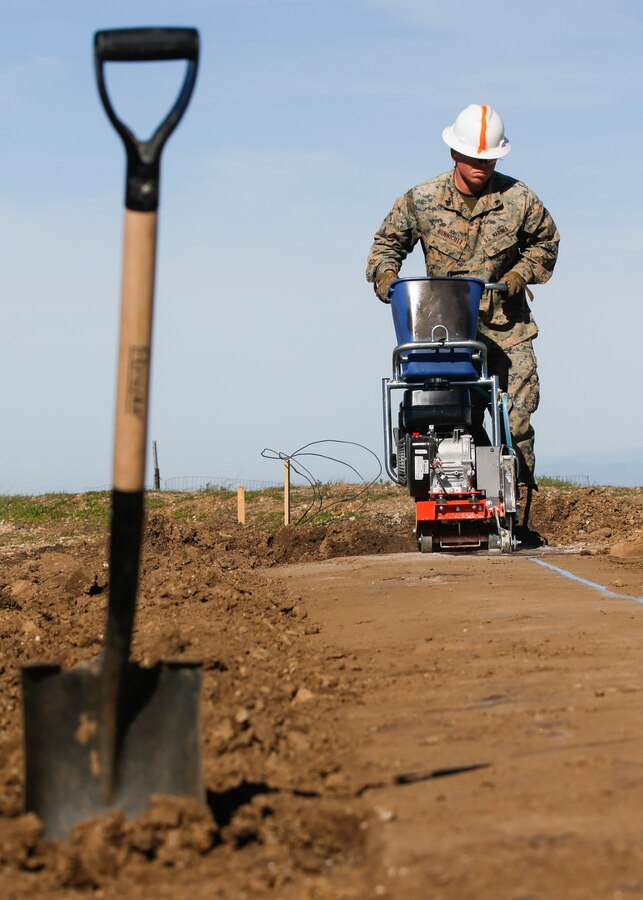 Cpl. Michael A. Hunnicut, a combat engineer with Marine Wing Support Squadron (MWSS) 373, Marine Wing Support Group (MWSG) 37, 3rd Marine Aircraft Wing (MAW), cuts through a concrete section at the construction site of the Airport in the Sky project at Catalina Island, Calif., Jan. 22. The Catalina Island Airport in the Sky project is a strategic training opportunity and allows a rare collaboration that benefits both the Marine Corps and the Catalina Island Conservancy. (U.S. Marine Corps photo by Lance Cpl. Juan Anaya)