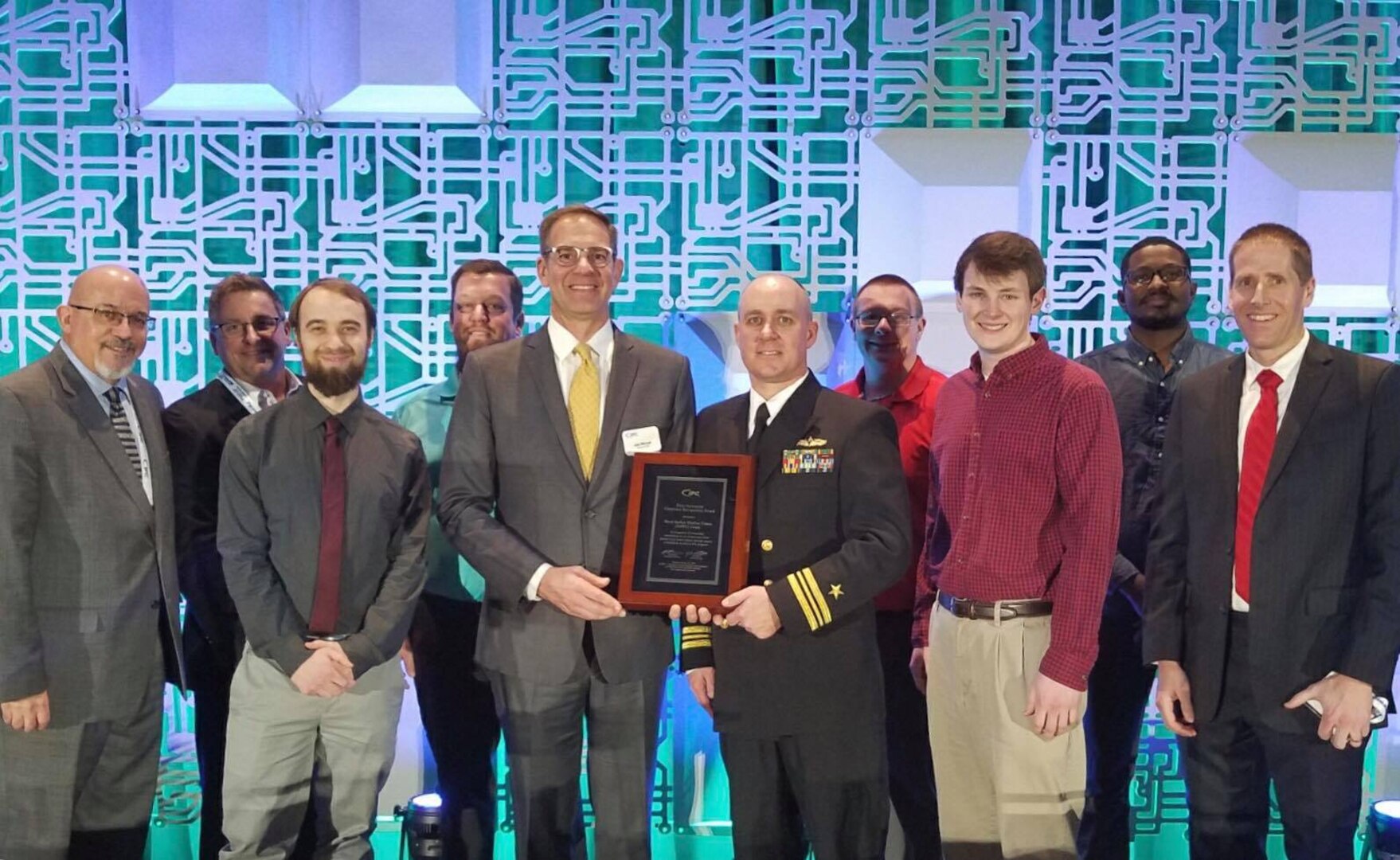Naval Surface Warfare Center, Crane Division (NSWC Crane) was recognized before an international audience for its contributions to the electronics industry with the IPC - Association Connecting Electronics Industries Peter Sarmanian Corporate Recognition Award. The award was presented to NSWC Crane representatives at the annual IPC APEX EXPO 2019 in San Diego, California on January 29.