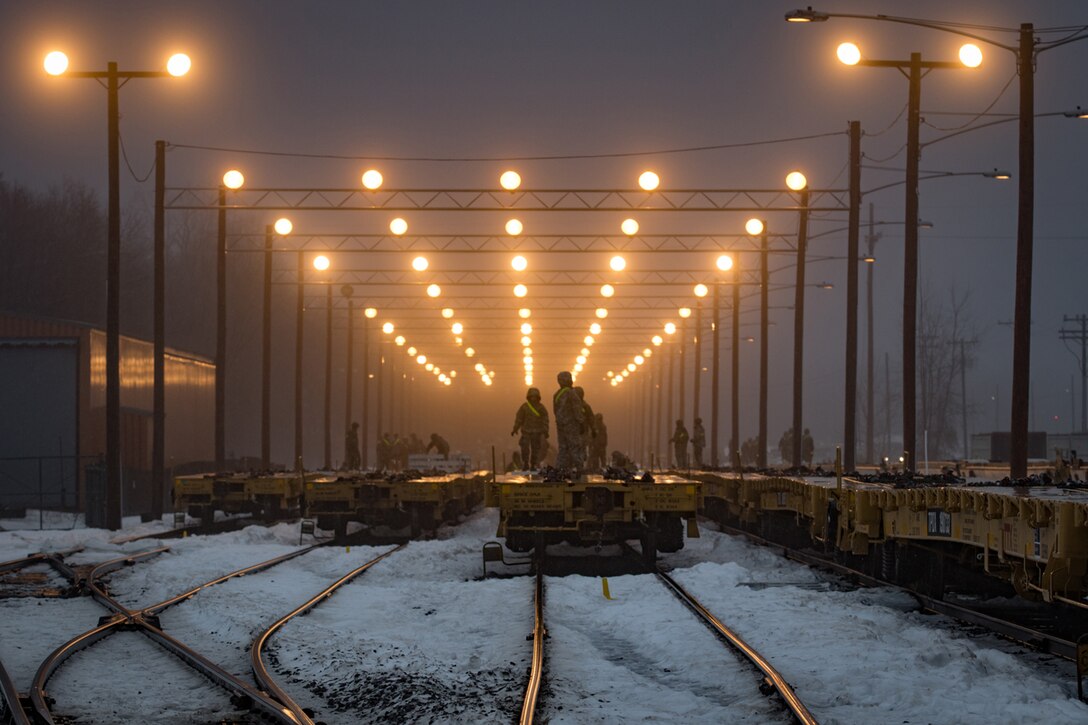 Soldiers conduct rail load operations.