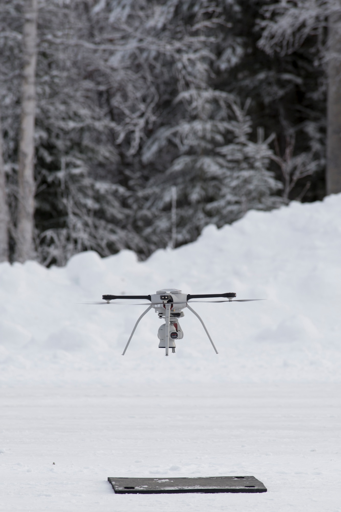 U.S. Air Force civil engineers fly a Small Unmanned Aircraft System during a newly adopted Rapid Airfield Damage Assessment System training course at Joint Base Elmendorf-Richardson, Alaska, Jan. 23, 2019. Throughout the first week of training, Airmen focused on learning to fly the SUAS. During the second week they learned to fly the RADAS mission while using the SUAS systems.