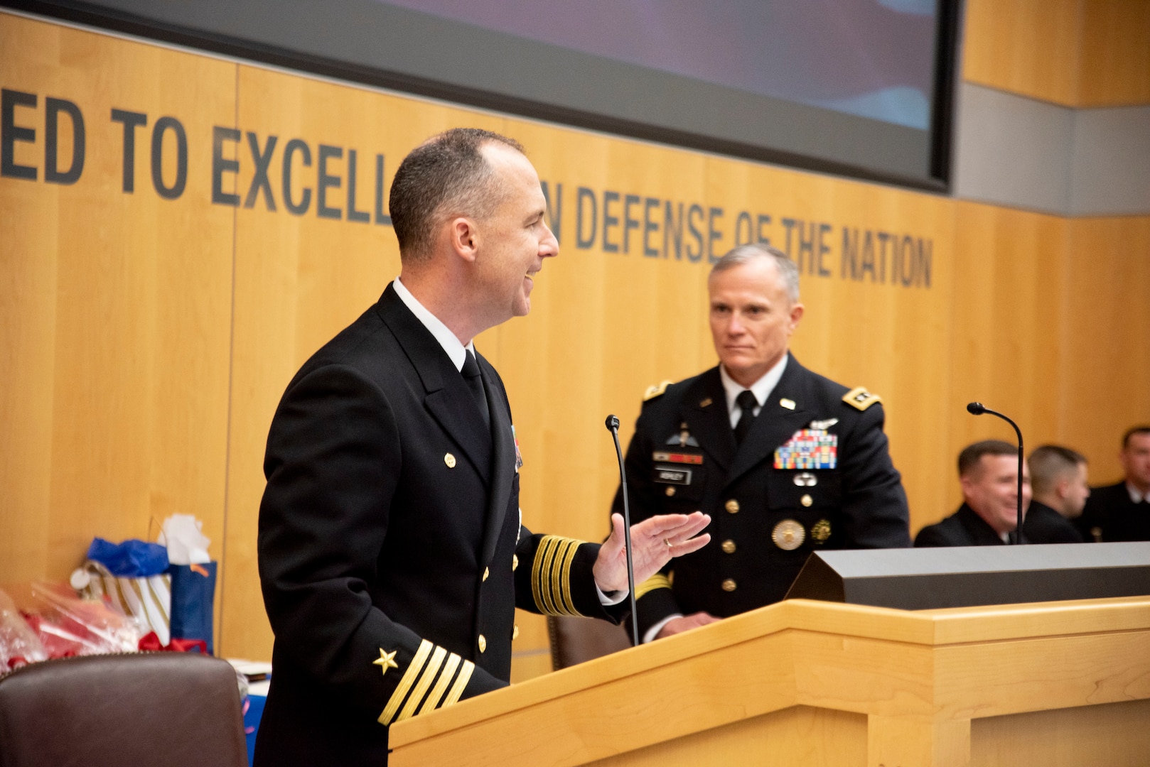 Outgoing Defense Intelligence Agency Navy Element Commander Capt. Joshua C. Himes (left) introduces the presiding officer, Defense Intelligence Agency Director Lt. Gen. Robert P. Ashley,. Jr., during a change of command ceremony, Jan. 30, at the DIA headquarters on Joint Base Anacostia-Bolling.