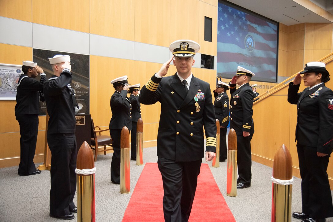 Capt. Joshua C. Himes is piped ashore after relinquishing command of Defense Intelligence Agency Navy Element during a change of command ceremony, Jan. 30, at the DIA headquarters on Joint Base Anacostia-Bolling.