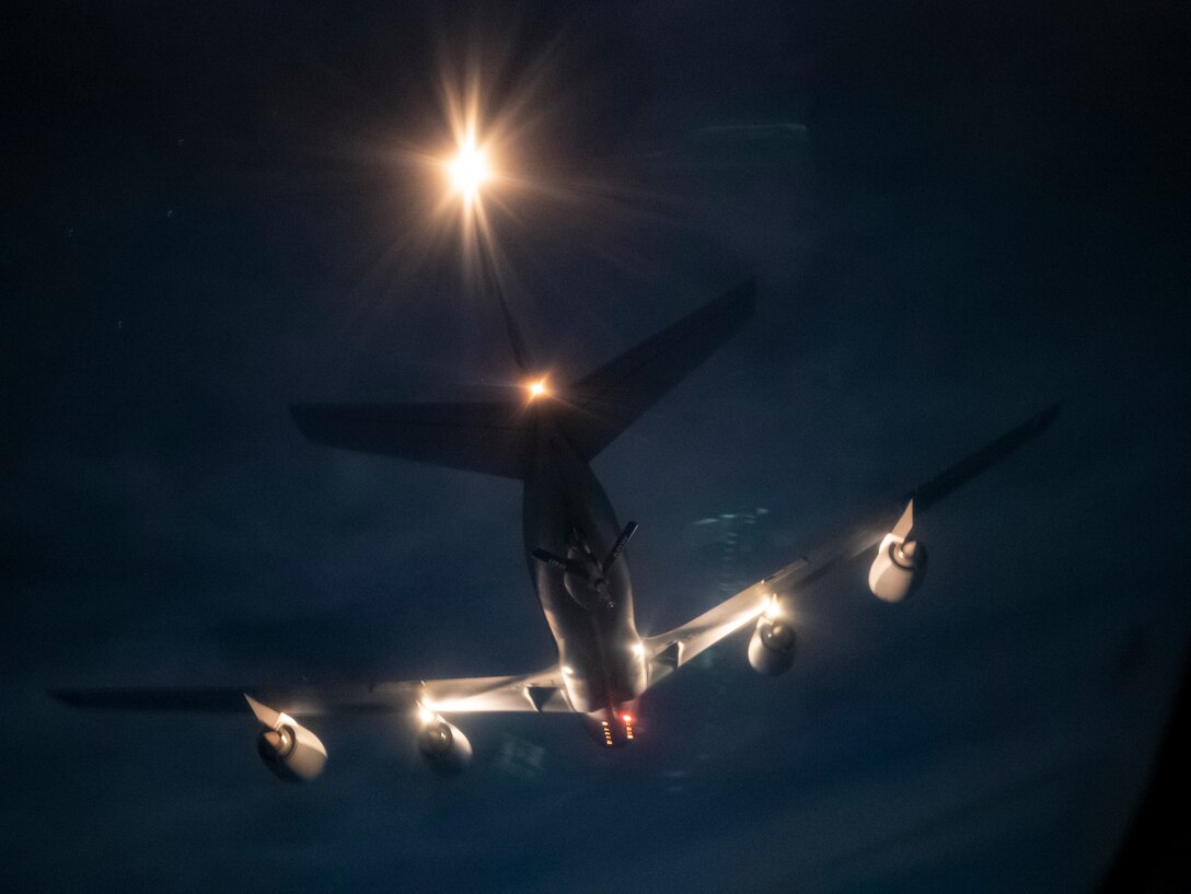 A KC-135 Stratotanker from the 186th Air Refueling Wing prepares to deliver fuel to a Hawaii Air National Guard C-17 Globemaster III