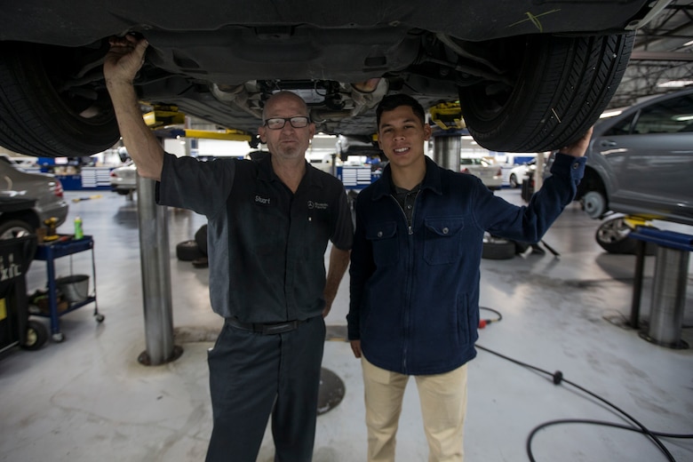 U.S. Marines with Motor Transport Platoon, 5th Marine Regiment, 1st Marine Division, get a first hand look on how the skills they learn in the Marine Corps transfer to the civilian sector when they shadow service technicians for a day.